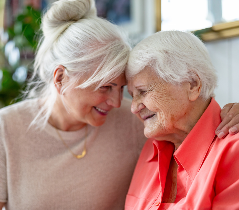 daughter embracing her older mother